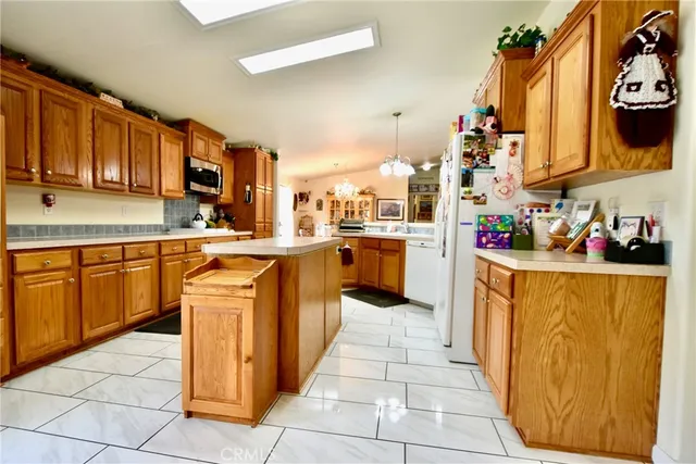 a kitchen with stainless steel appliances granite countertop a sink counter space and cabinets