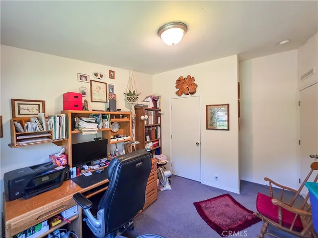 a view of a workspace with furniture and toys