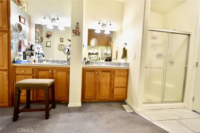 a white toilet sitting next to a shower