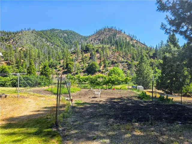 a view of balcony with wooden floor and outdoor seating