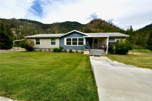 a front view of a house with yard