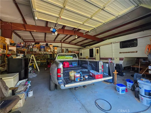 a living room with furniture a rug and a large window