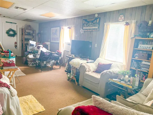 an aerial view of lake and residential houses with outdoor space