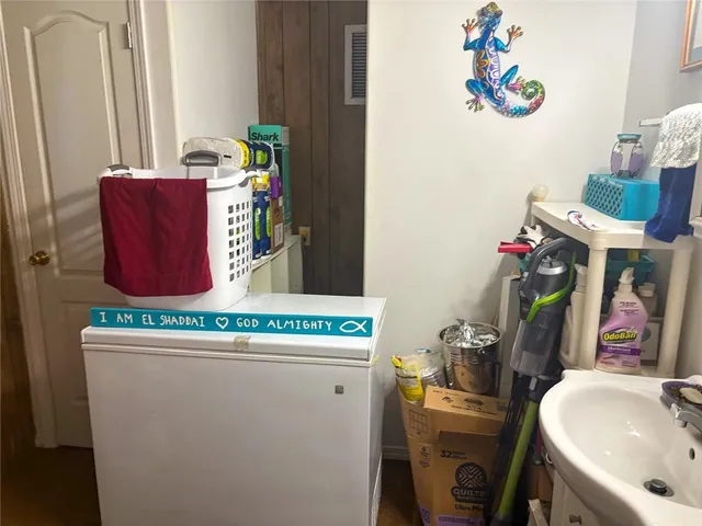 an aerial view of a house with a yard and lake view