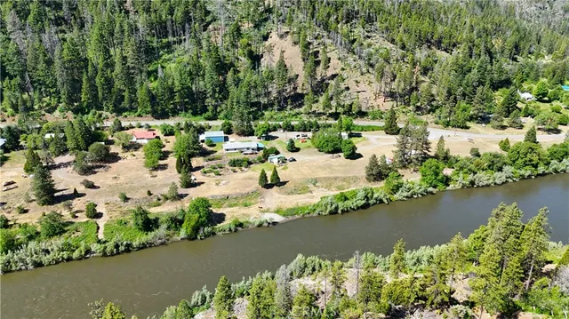 an aerial view of a house with a yard and garden