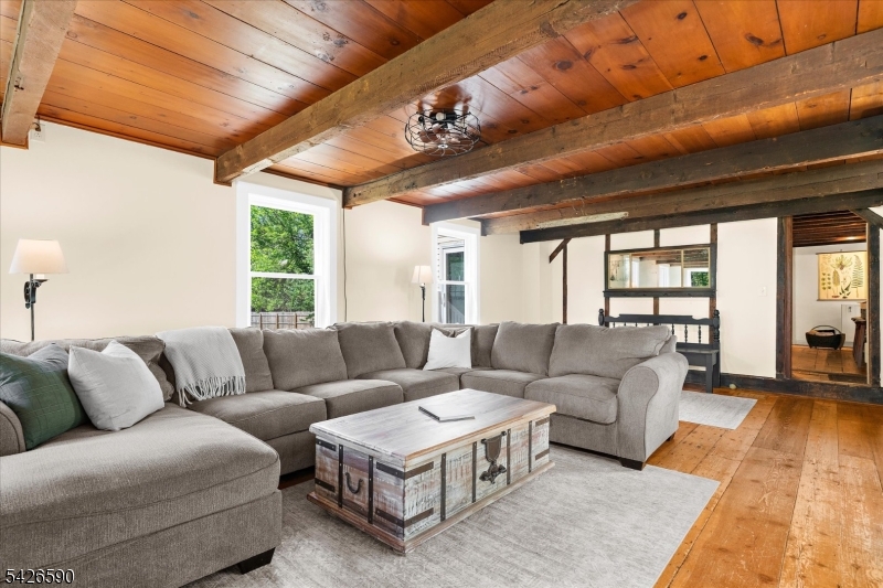 179 Lindbergh Road Hopewell, NJ 08525 - Photo 8 of 46 a living room with furniture and a large window