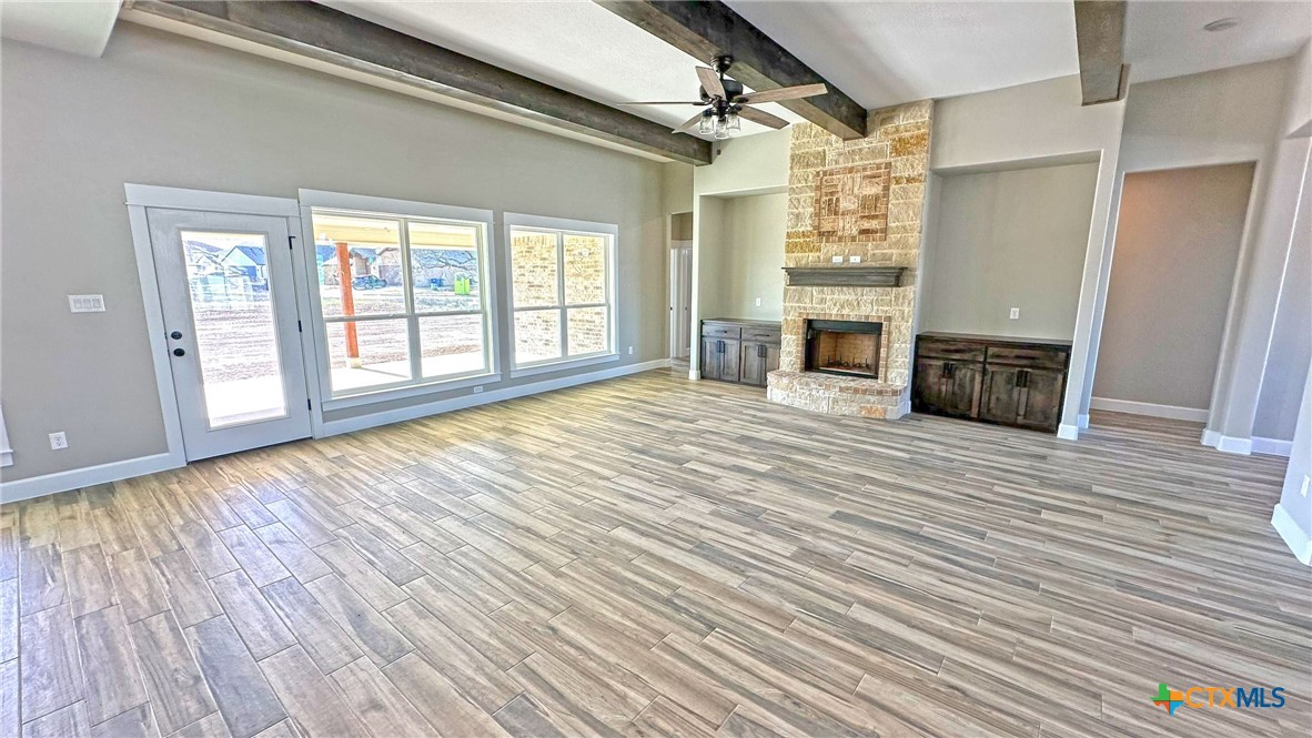 115 Overlook Trail Copperas Cove, TX 76522 - Photo 14 of 34 a view of a livingroom with wooden floor and a fireplace