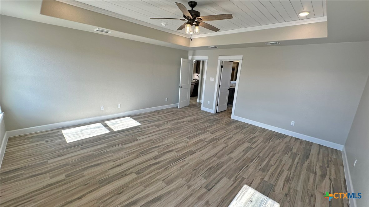 115 Overlook Trail Copperas Cove, TX 76522 - Photo 25 of 34 a view of empty room with wooden floor and ceiling fan