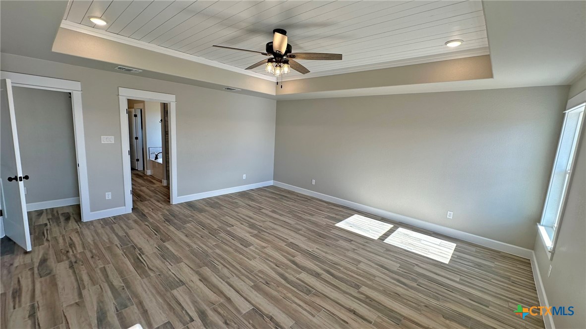 115 Overlook Trail Copperas Cove, TX 76522 - Photo 26 of 34 wooden floor in an empty room with a window