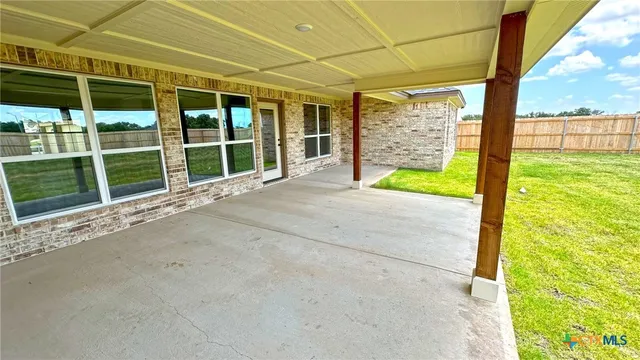 a view of a porch with a garden