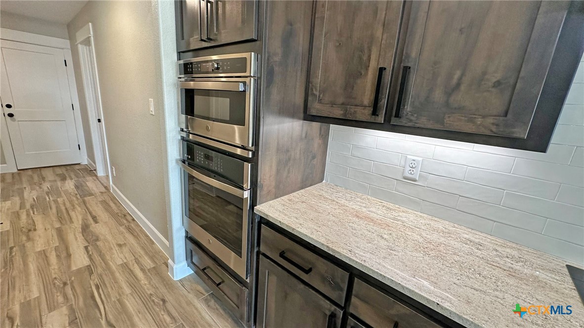 115 Overlook Trail Copperas Cove, TX 76522 - Photo 8 of 34 a kitchen with a refrigerator and microwave