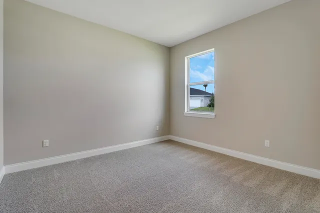 an empty room with closet area