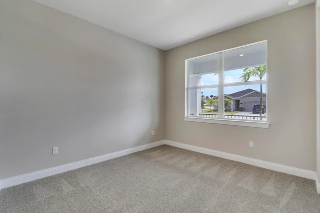 an empty room with closet area