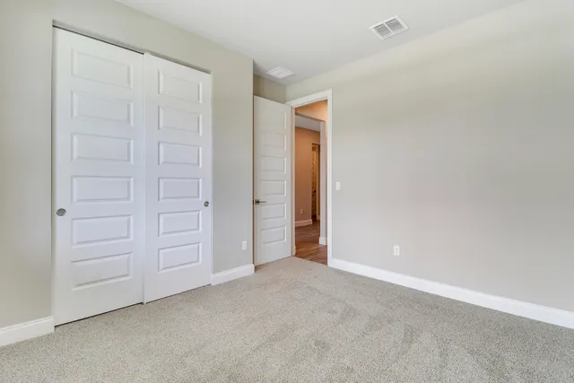 a bathroom with a granite countertop sink a toilet and a bathtub