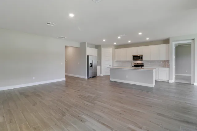 a view of kitchen with wooden floor and window