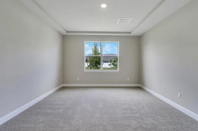 a view of an empty room and closet area