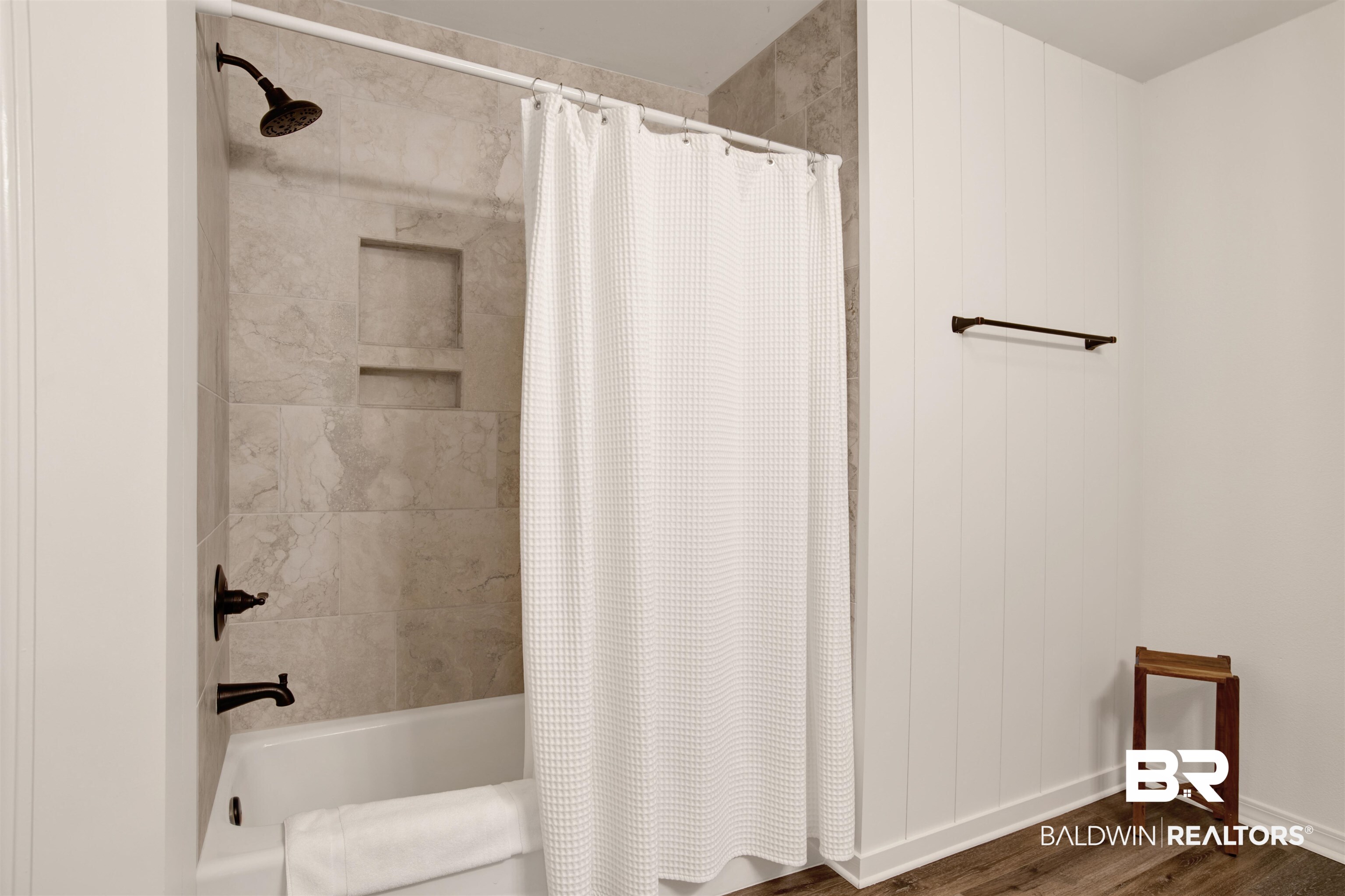 4012 Kendallbrook Loop Foley, AL 36535 - Photo 16 of 31 Full bathroom featuring wood finished floors and shower / bath combo with shower curtain