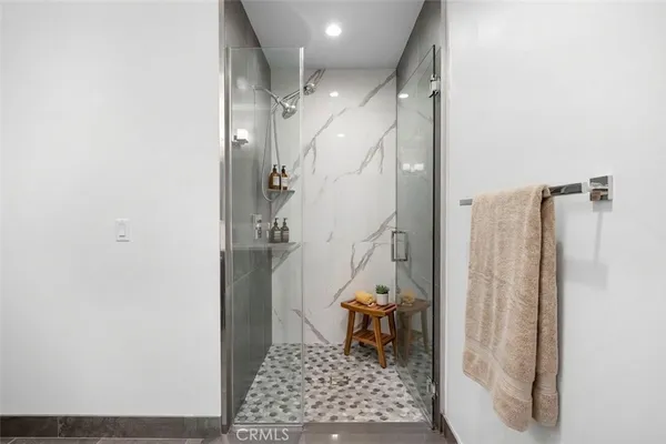 a view of a living room with stainless steel appliances wooden floor and livingroom view