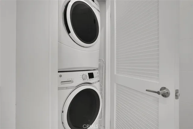 a spacious bathroom with double sink and a mirror