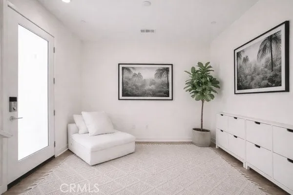 a living room with furniture and stairs