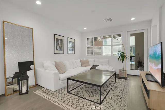 a view of a room with a chair and a potted plant
