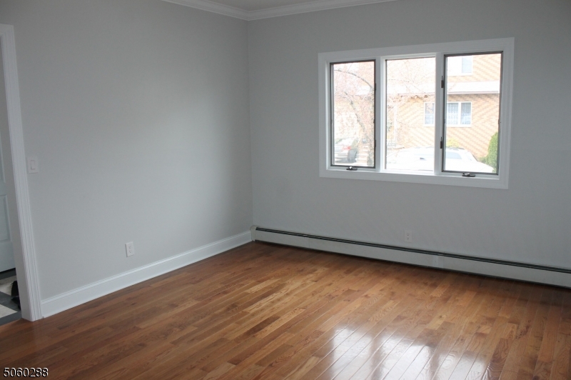 164 Main Street, Unit 2 Garfield, NJ 07026 - Photo 2 of 24 an empty room with a window