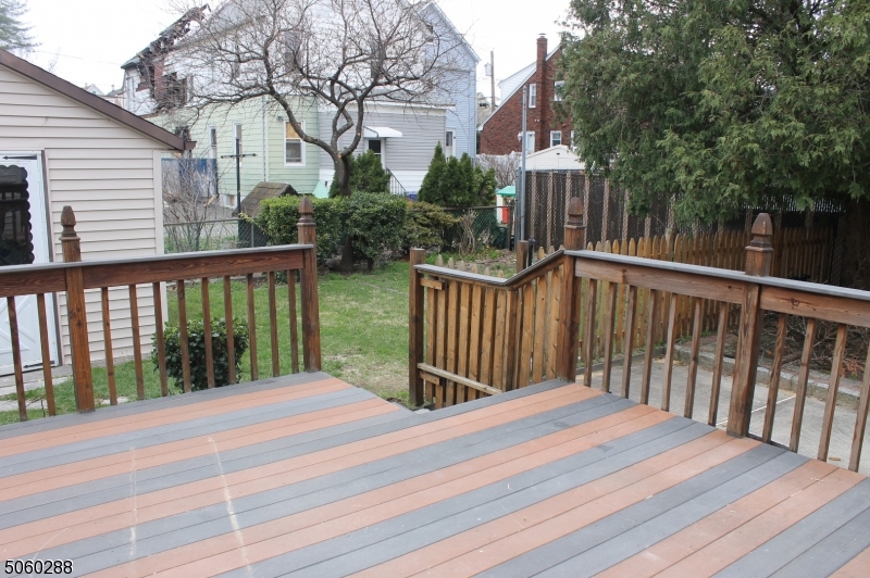 164 Main Street, Unit 2 Garfield, NJ 07026 - Photo 17 of 24 a view of balcony with wooden floor and fence