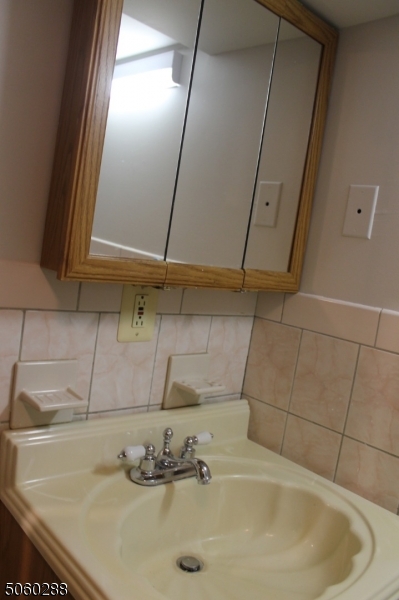 164 Main Street, Unit 2 Garfield, NJ 07026 - Photo 20 of 24 a bathroom with a sink
