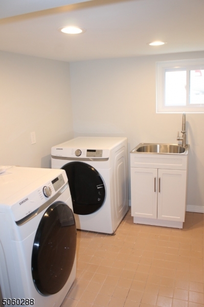 164 Main Street, Unit 2 Garfield, NJ 07026 - Photo 21 of 24 a utility room with dryer and washer