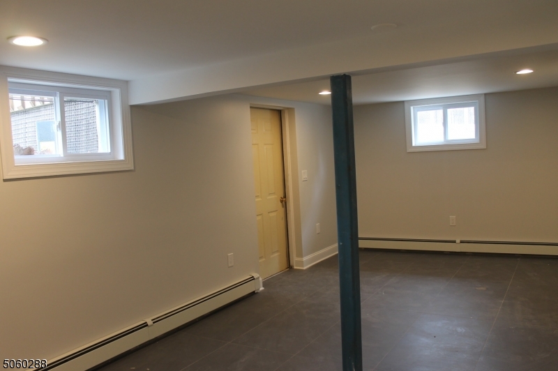 164 Main Street, Unit 2 Garfield, NJ 07026 - Photo 24 of 24 an empty room with a door
