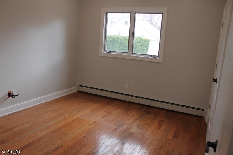 164 Main Street, Unit 2 Garfield, NJ 07026 - Photo 10 of 24 an empty room with a window