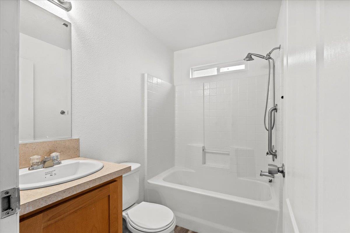 1249 Magic Sands Way Turlock, CA 95380 - Photo 11 of 13 a bathroom with a granite countertop sink toilet and shower