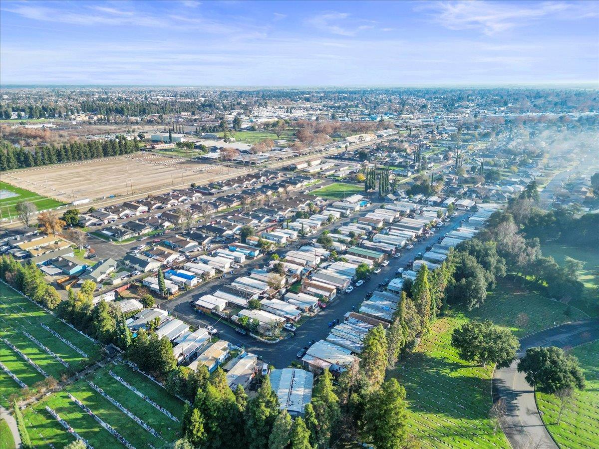 1249 Magic Sands Way Turlock, CA 95380 - Photo 13 of 13 an aerial view of residential houses with outdoor space and trees