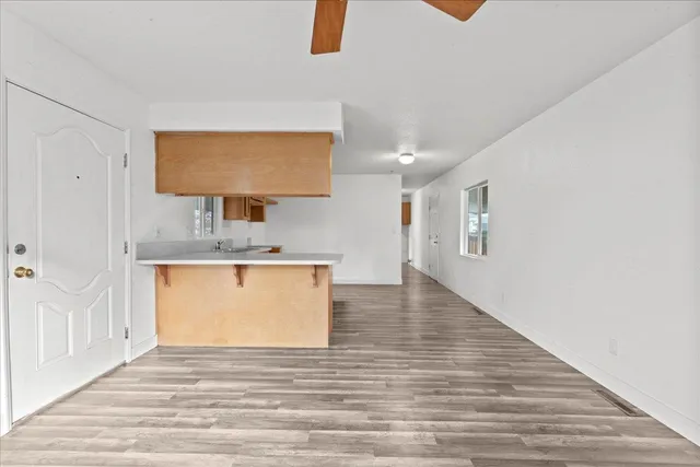 a view of a kitchen from the hallway