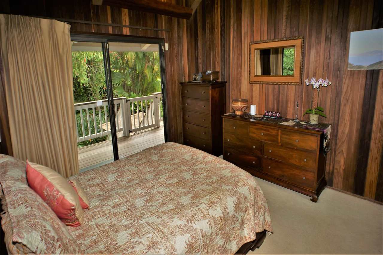 26 Manu Street Kula, HI 96790 - Photo 13 of 30 a bedroom with a bed dresser and a window