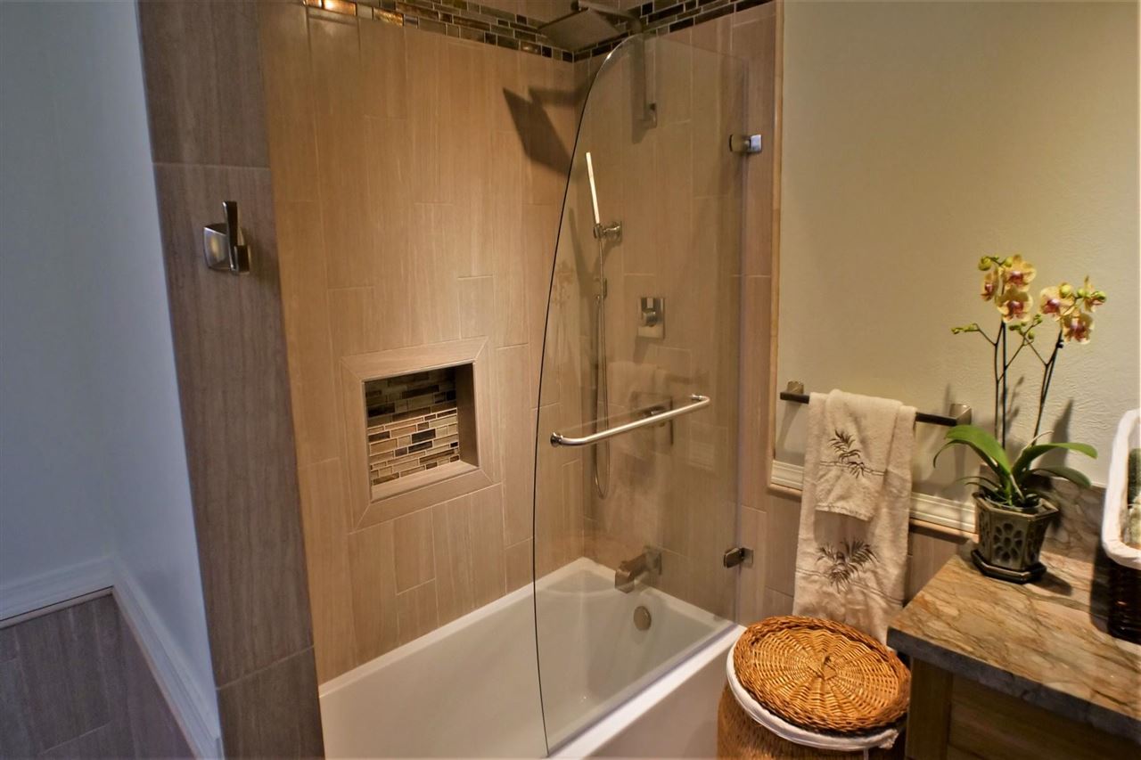 26 Manu Street Kula, HI 96790 - Photo 16 of 30 a bathroom with a granite countertop sink toilet and shower