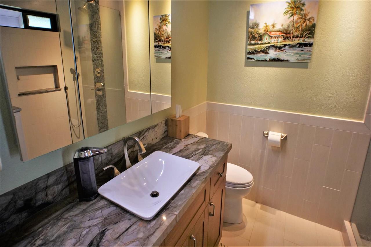 26 Manu Street Kula, HI 96790 - Photo 19 of 30 a bathroom with a sink a toilet and mirror