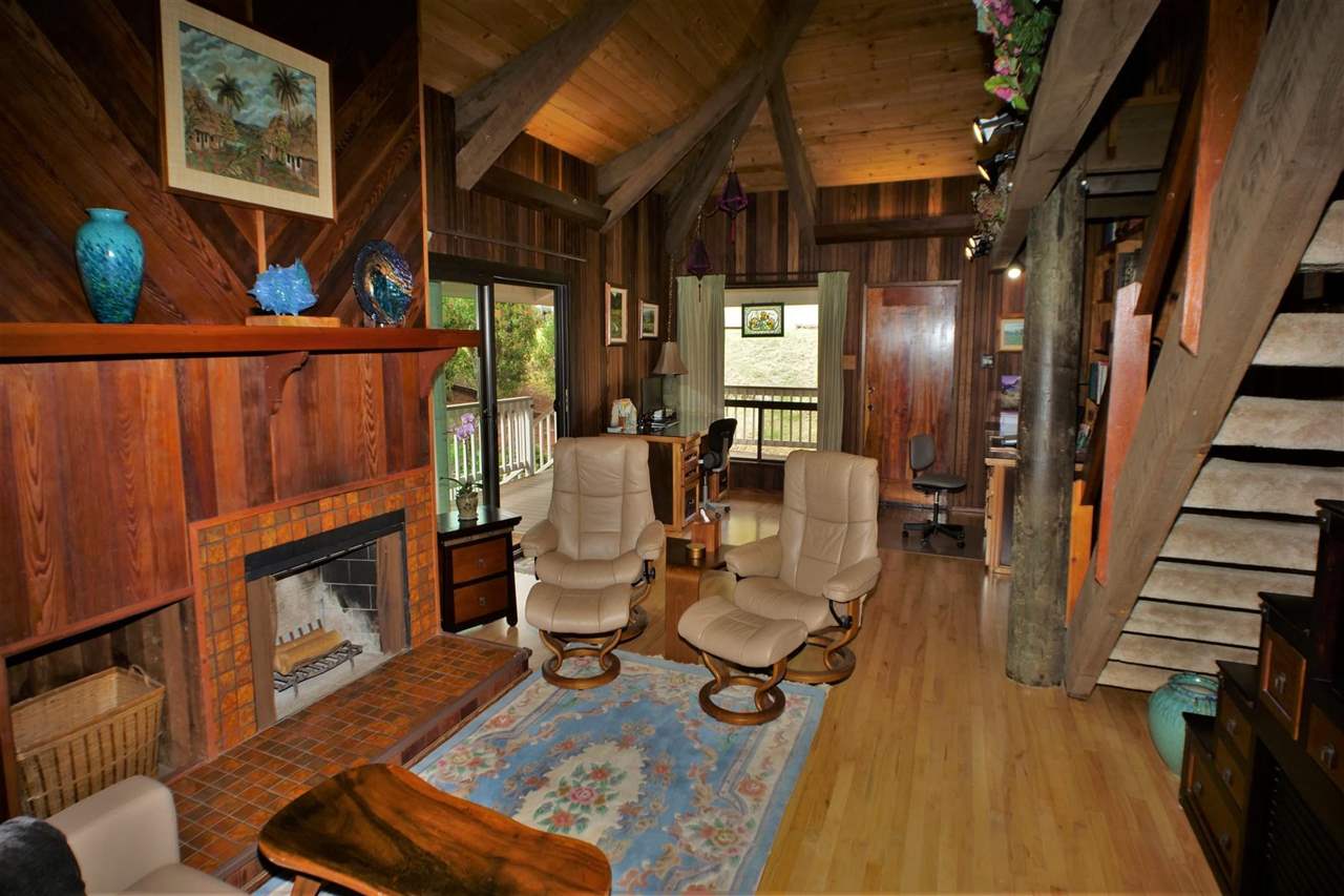 26 Manu Street Kula, HI 96790 - Photo 3 of 30 a living room with furniture a fireplace and next to windows