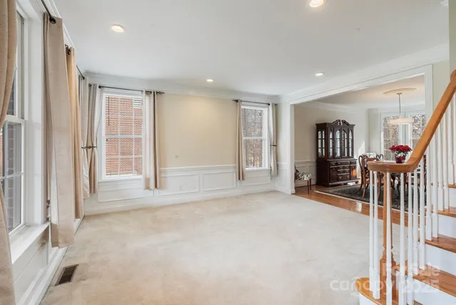 an aerial view of a house with swimming pool and patio