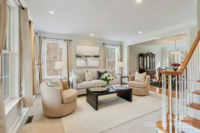 a view of a tennis court with large trees