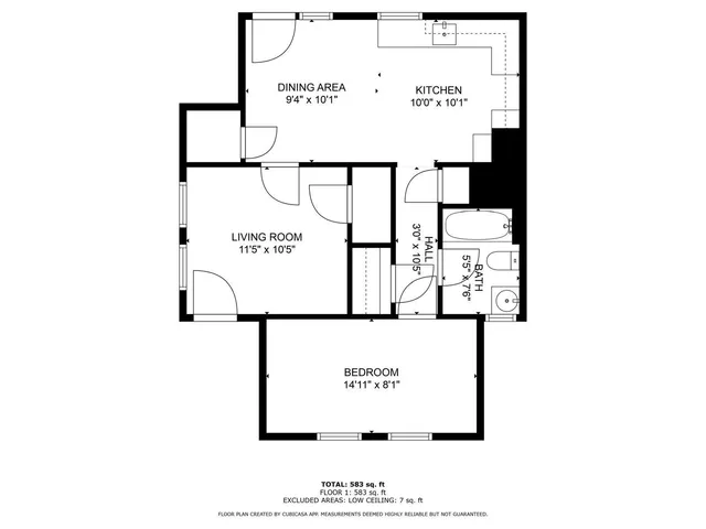 a picture of a bench in front of a wall