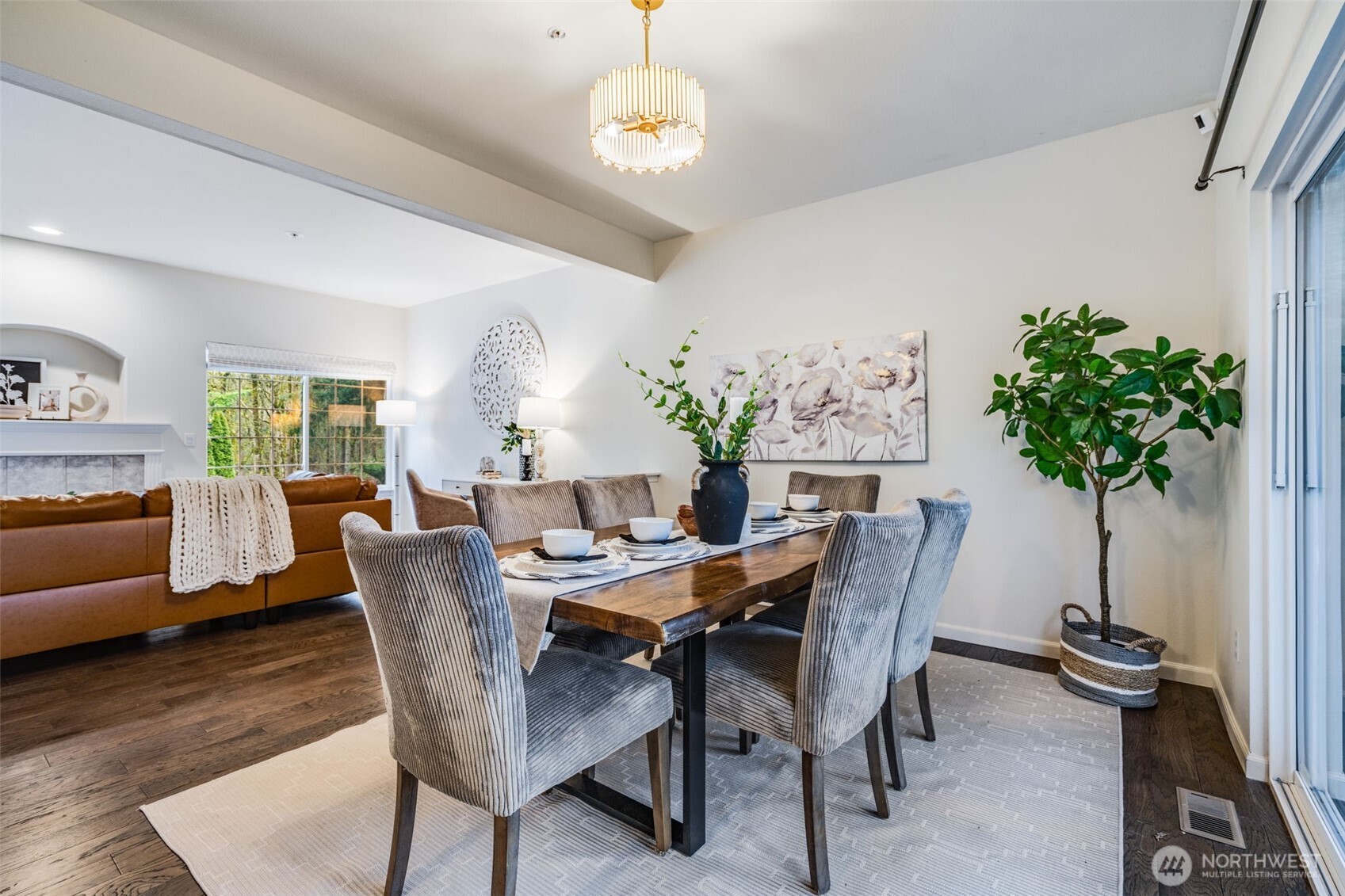14503 Simonds Road Northeast, Unit C Kirkland, WA 98034 - Photo 12 of 29 a view of a dining room with furniture window and wooden floor
