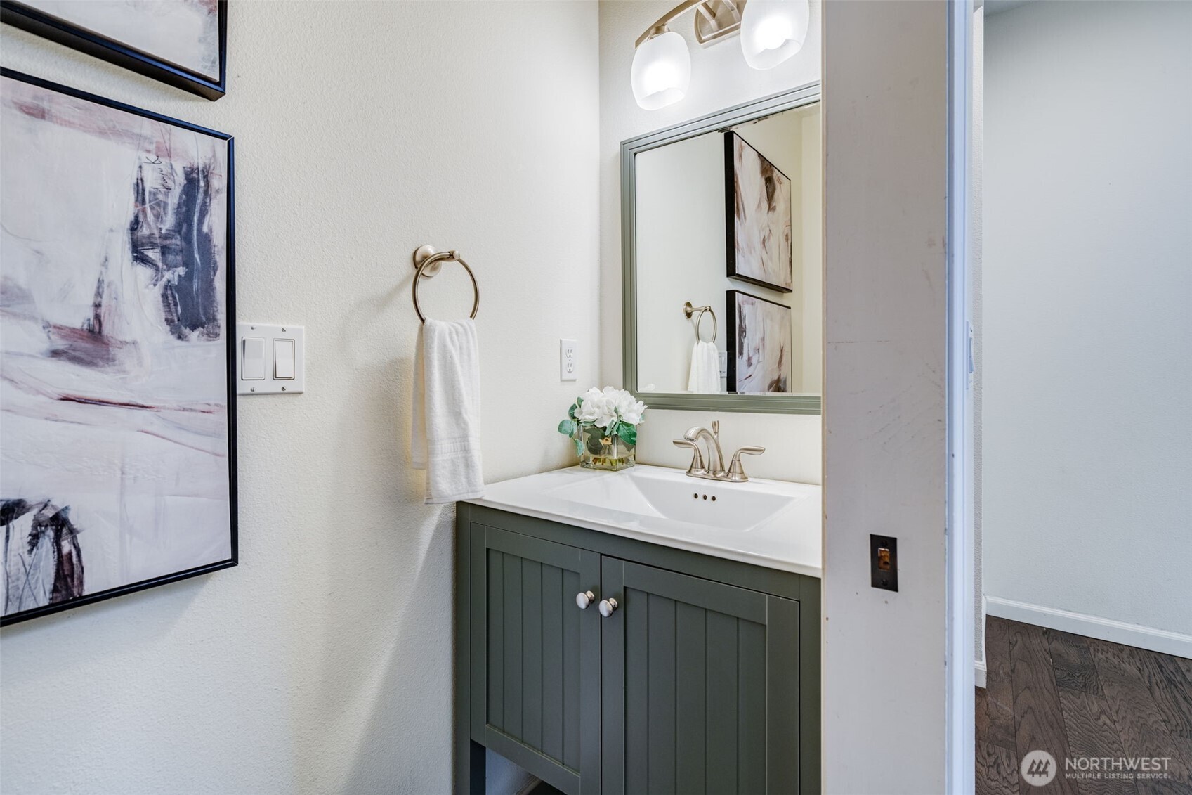 14503 Simonds Road Northeast, Unit C Kirkland, WA 98034 - Photo 13 of 29 a bathroom with a sink a mirror and vanity