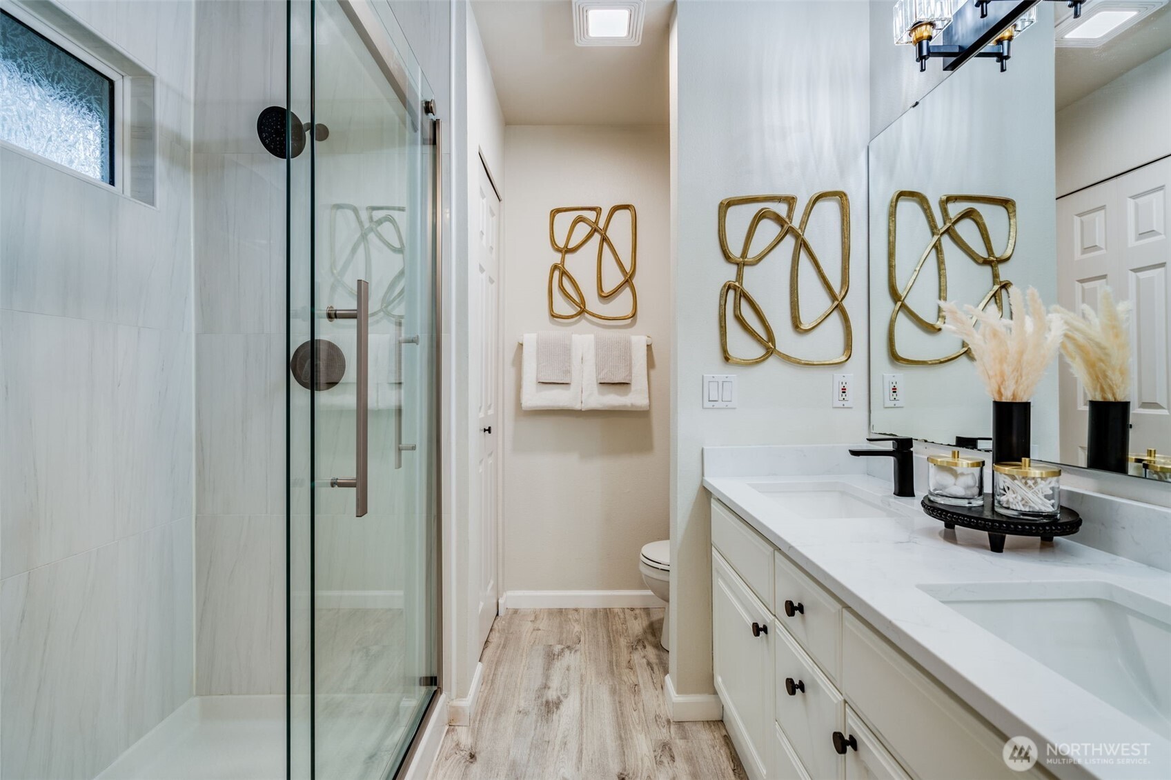 14503 Simonds Road Northeast, Unit C Kirkland, WA 98034 - Photo 20 of 29 a bathroom with a sink and a mirror