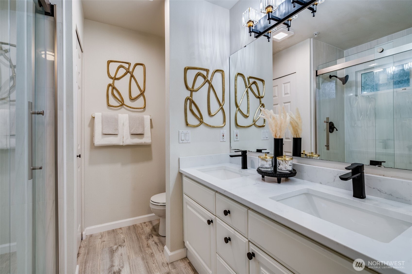 14503 Simonds Road Northeast, Unit C Kirkland, WA 98034 - Photo 21 of 29 a bathroom with a sink a toilet and a mirror