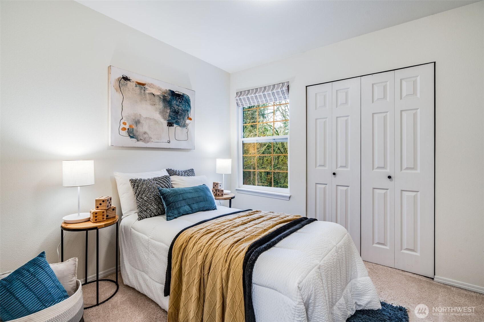 14503 Simonds Road Northeast, Unit C Kirkland, WA 98034 - Photo 23 of 29 a bedroom with a bed and a window