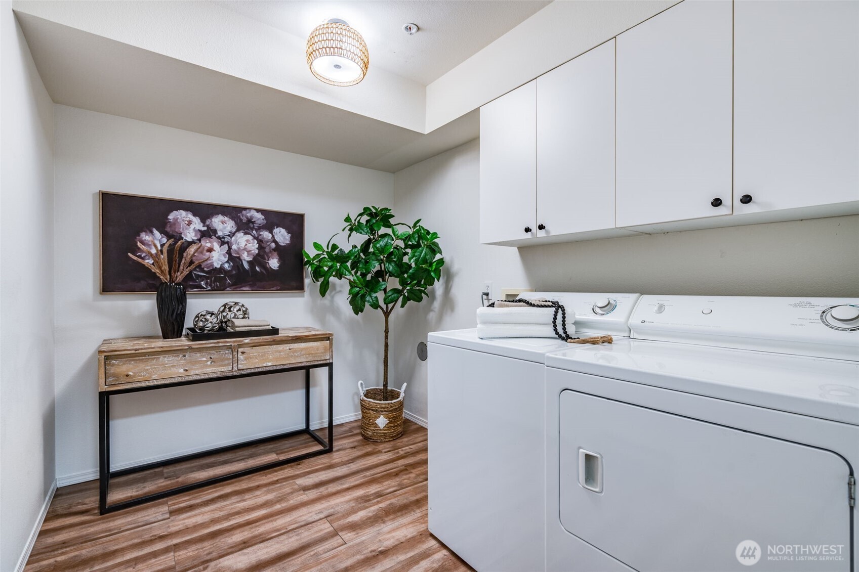 14503 Simonds Road Northeast, Unit C Kirkland, WA 98034 - Photo 28 of 29 a utility room with cabinets washer and dryer
