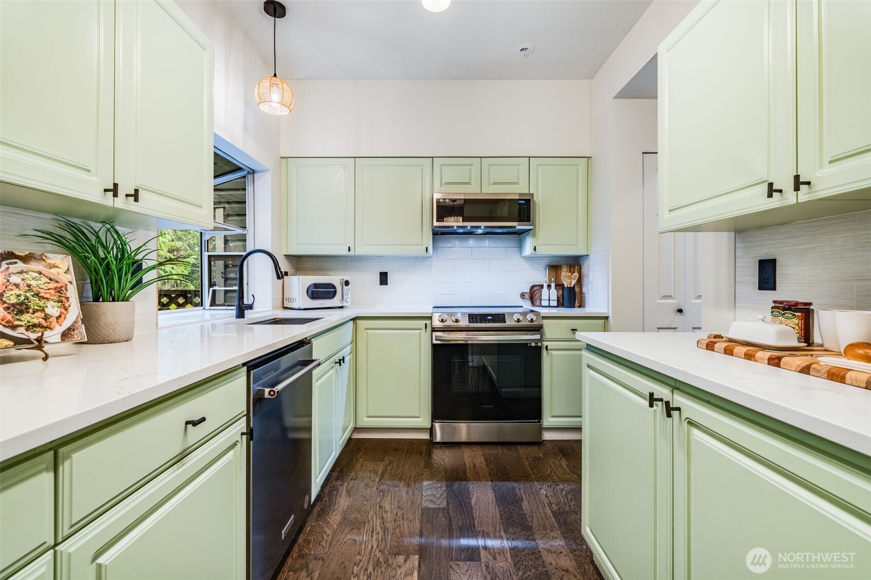 14503 Simonds Road Northeast, Unit C Kirkland, WA 98034 - Photo 7 of 29 a kitchen with a sink cabinets and stainless steel appliances