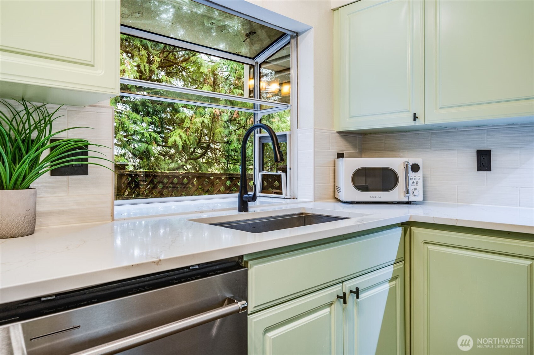 14503 Simonds Road Northeast, Unit C Kirkland, WA 98034 - Photo 9 of 29 a kitchen with a sink and a window