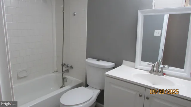a bathroom with a toilet and a sink